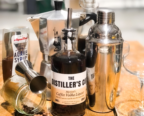Bottle of Coffee Vodka Liqueur with Coffee beans, Cocktail shaker