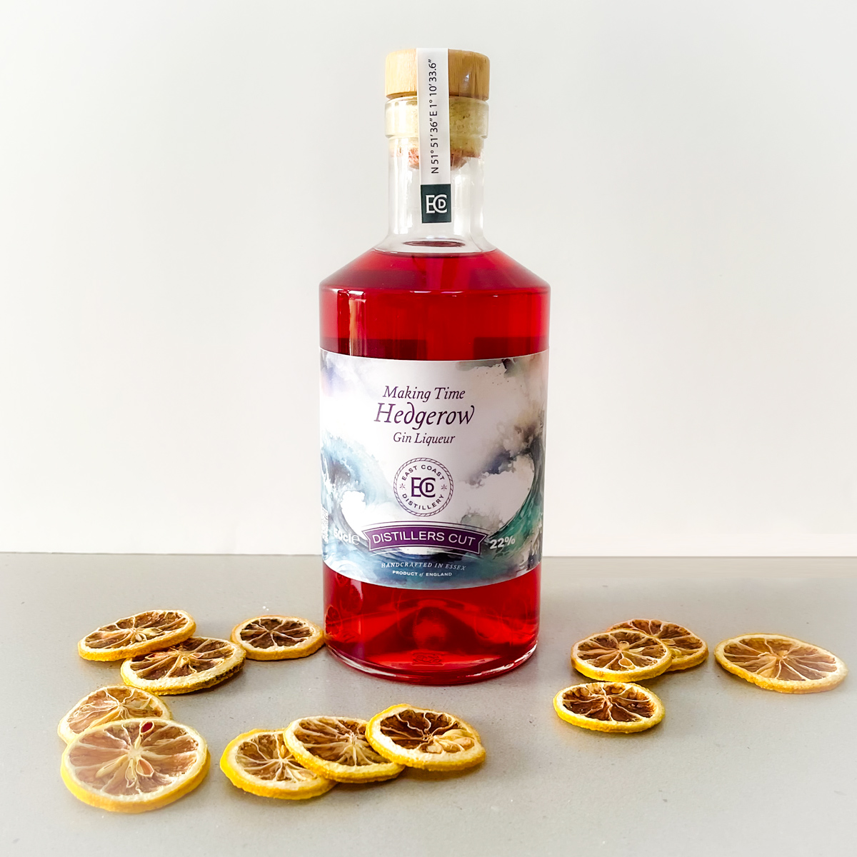 Bottle of Hedgerow Gin Liqueur with dried fruit
